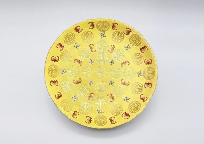 A good and rare yellow ground famille rose ‘Longevity’ dish