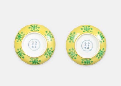 A fine and rare pair of yellow ground green-glazed saucer dishes