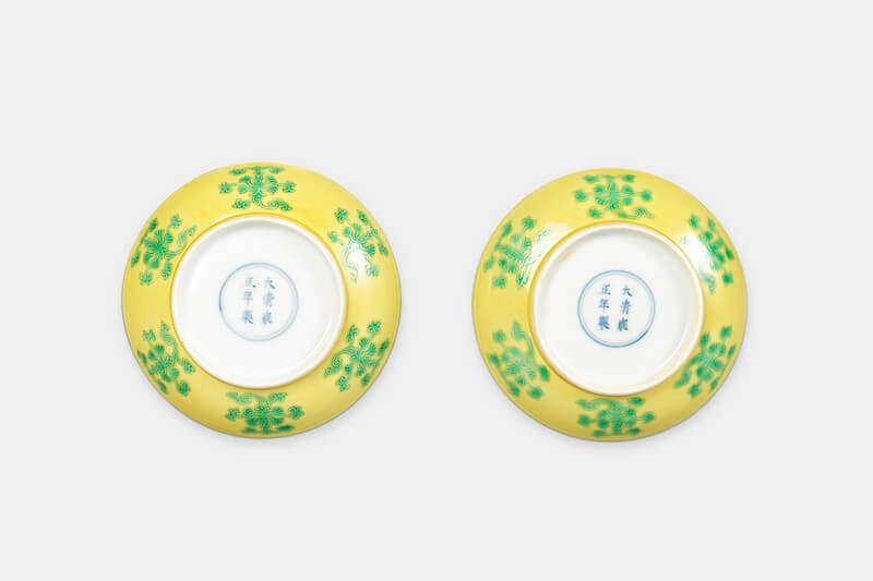 A fine and rare pair of yellow ground green-glazed saucer dishes
