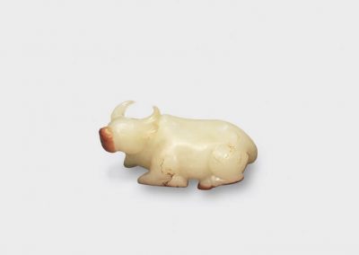 A fine and rare white jade carving of a recumbent ox