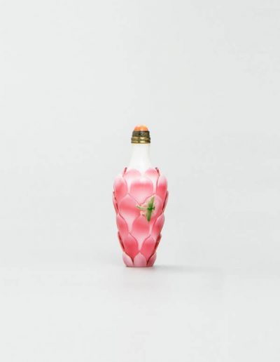 A fine and rare white ground pink overlay lotus-shaped snuff bottle
