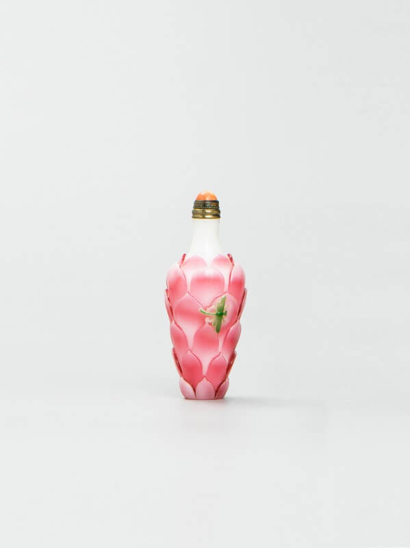 A fine and rare white ground pink overlay lotus-shaped snuff bottle